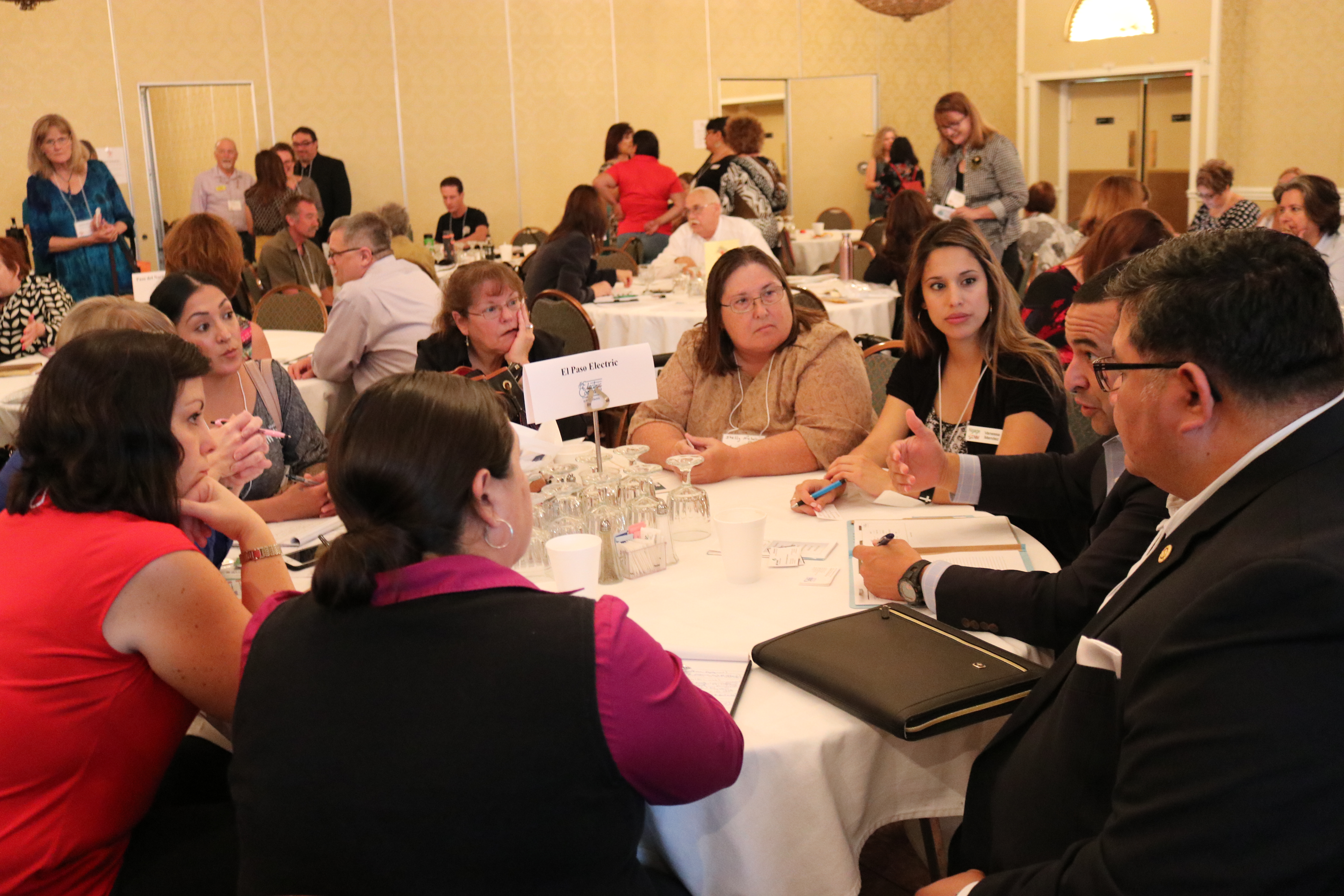 Discussion at table among group at nonprofit conference